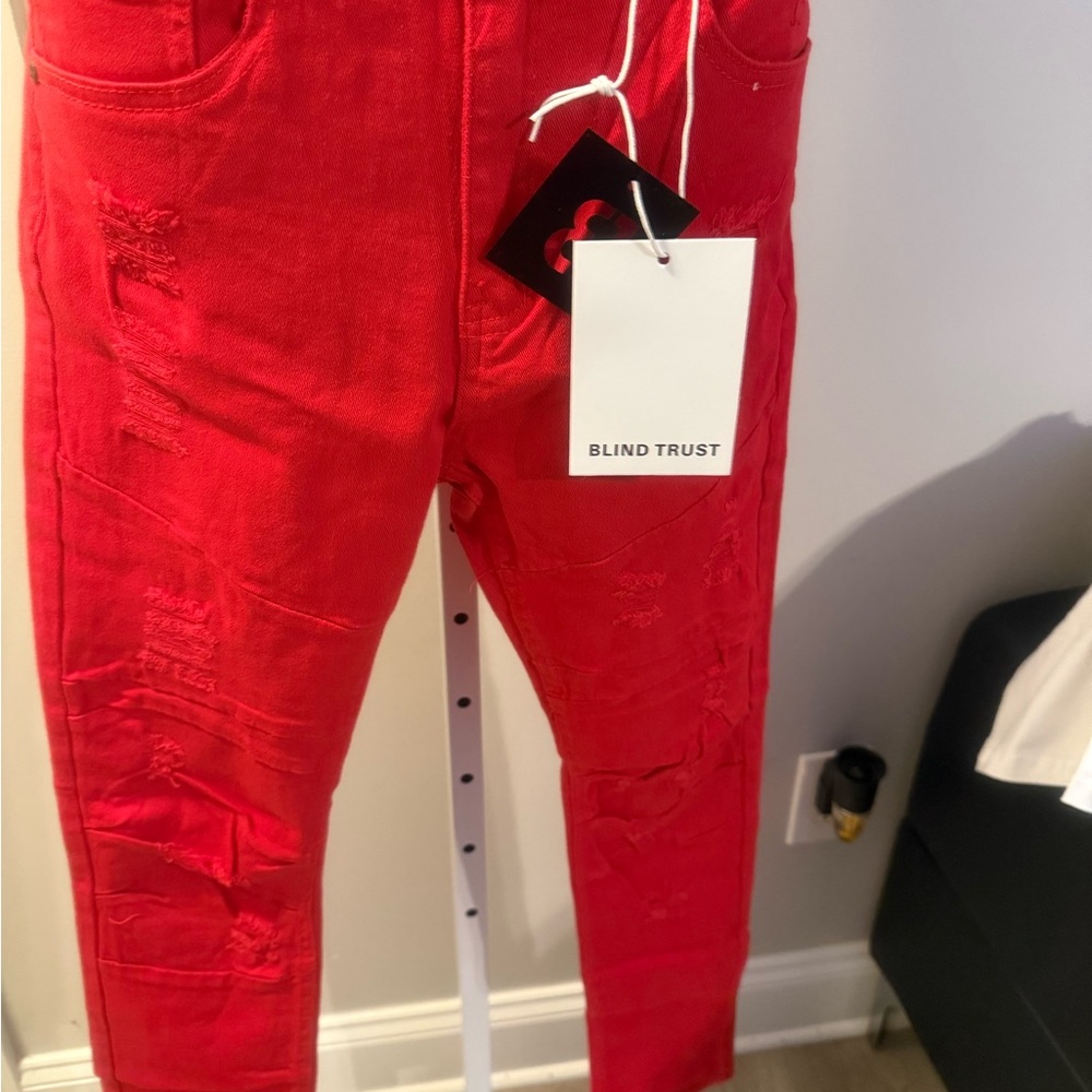 Men's Red Skinny Jeans. Size vary